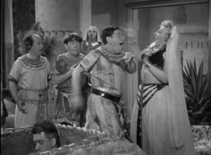 Shemp being 'awarded' with the king's homely daughter in the Three Stooges short film, Mummy's Dummies