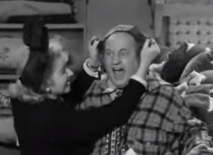 Christine McIntyre pulling Larry's hair out in Hugs and Mugs - Three Stooges short film
