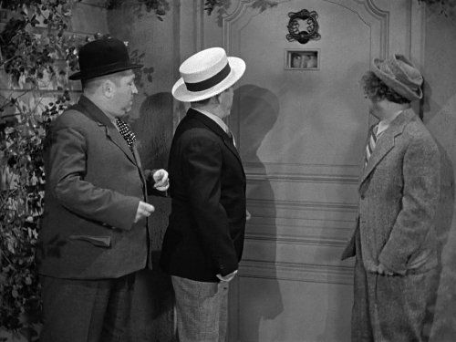 Curly, Larry and Moe about to knock on the door of the "haunted" house in the Three Stooges short film, Spook Louder