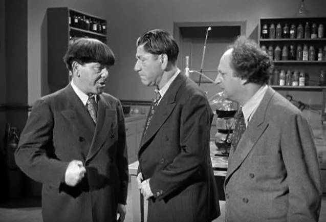 The Three Stooges (Moe, Shemp, Larry) planning their escape in Fuelin' Around
