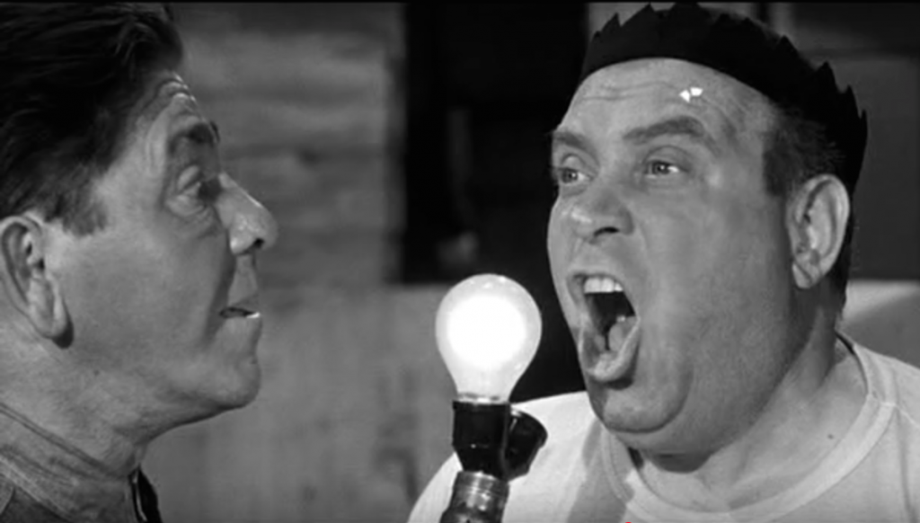 Moe Howard gives Joe Besser a medical exam in Muscle Up a Little Closer
