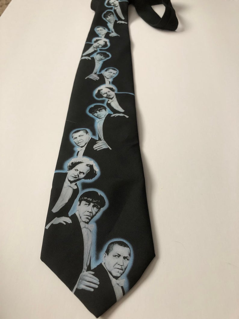 Necktie featuring the Three Stooges (Moe, Larry, Curly) in tuxedos