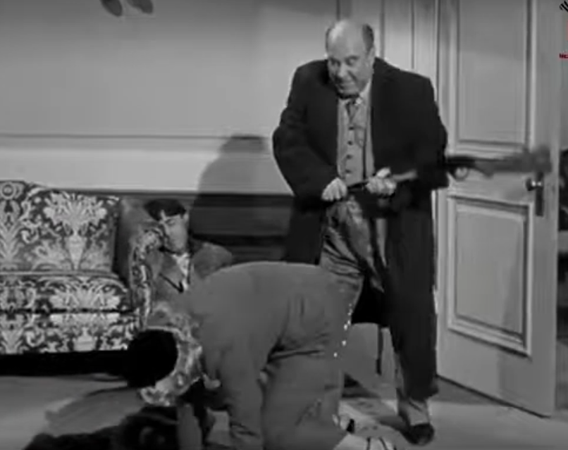 Joe Besser spanking Connie Cezon, after shooting her posterior full of tacks, in Rusty Romeos