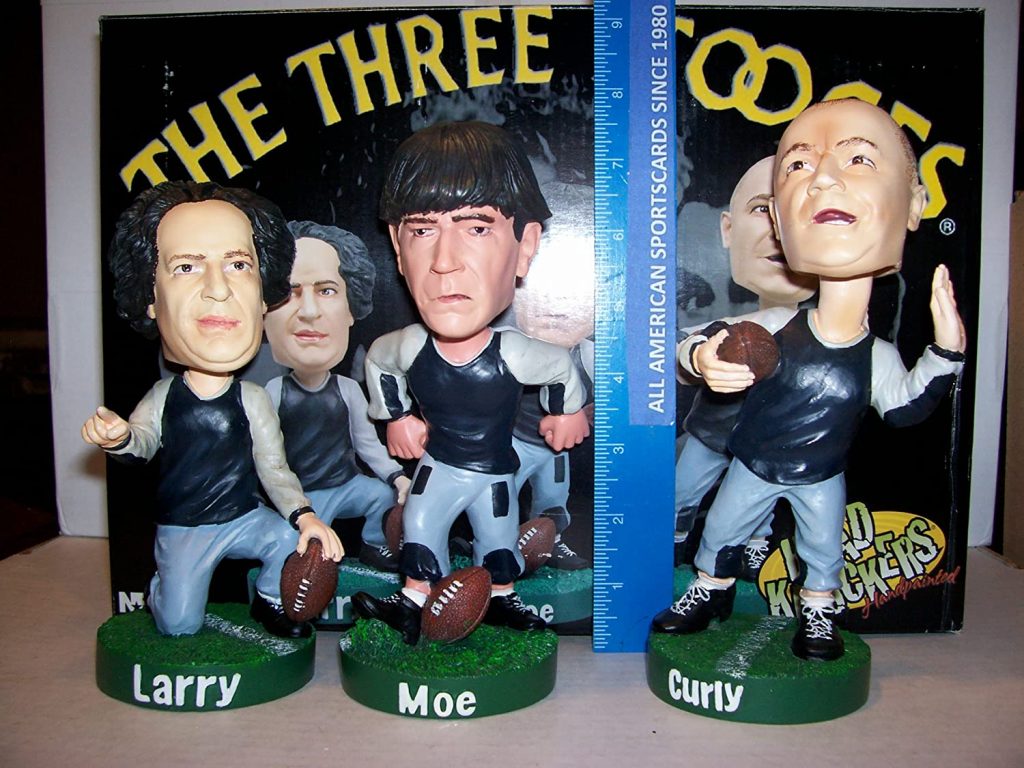 Exactly what it sounds like - The Three Stooges - Curly, Moe, and Larry - as bobble heads, in their football gear from Three Little Pigskins.
