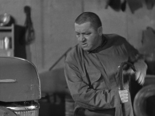 Curly Howard as a mechanic in "Higher Than a Kite"