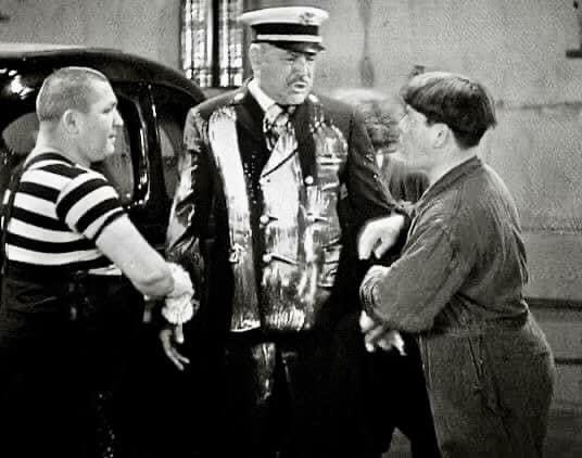 Look what you did to the Captain's coat! The suffering Stanley Blystone with Moe, Larry, Curly in "False Alarms"