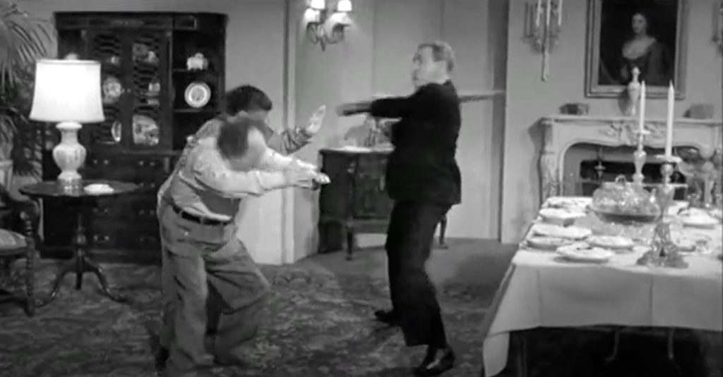 Kenneth MacDonald attacks Moe Howard and Larry Fine in "Scheming Schemers"