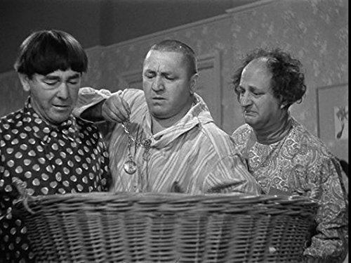 The Three Stooges (Moe, Larry, Curly) with the baby in a basket in "Sock-A-Bye Baby"