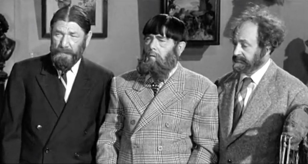 Three Stooges wearing beards in "Stone Age Romeos"