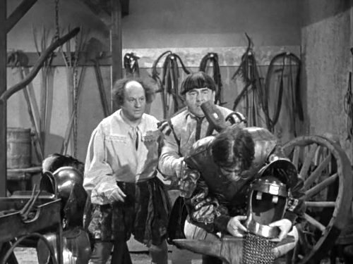 Larry and Moe getting Shemp out of the armor the hard way