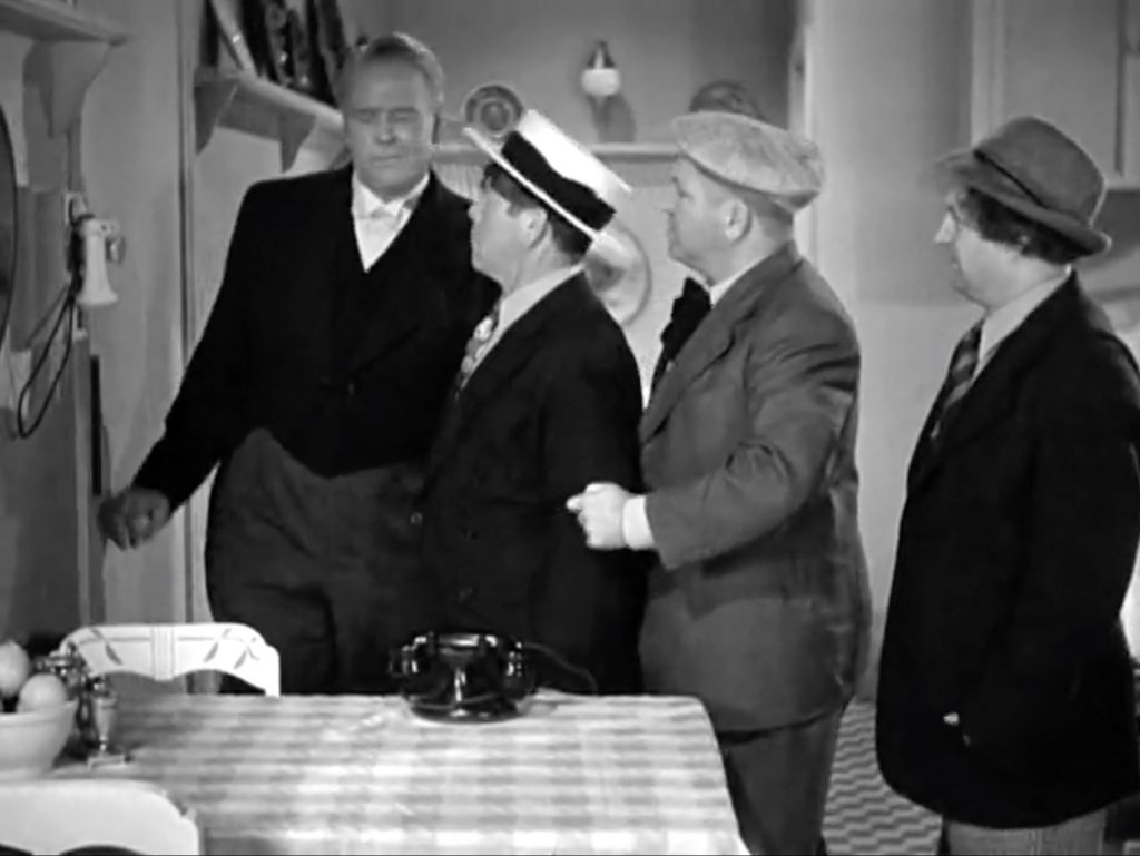 Bud Jamison as the butler with he Three Stooges (Moe,Larry, Curly) in his final appearance with the group in "Flash Goes the Hash"