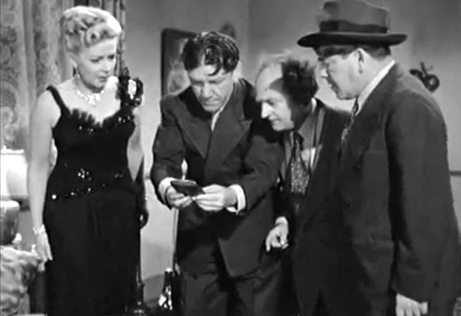 Bea (Christine McIntyre) being "interrogated" by Shemp, Moe and Larry, mistakenly thinking that the 3 would-be reporters are police detectives
