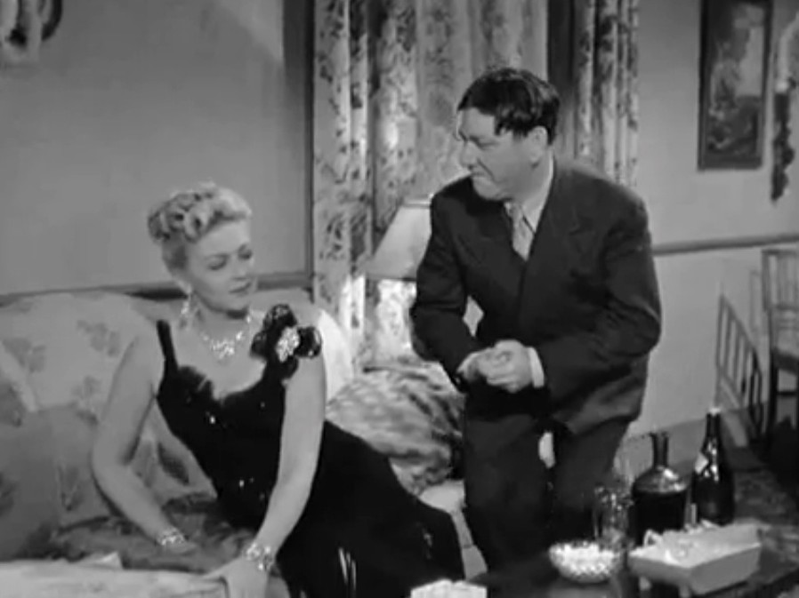 Trying to change their minds, Bea (Christine McIntyre) plies her wiles on Shemp