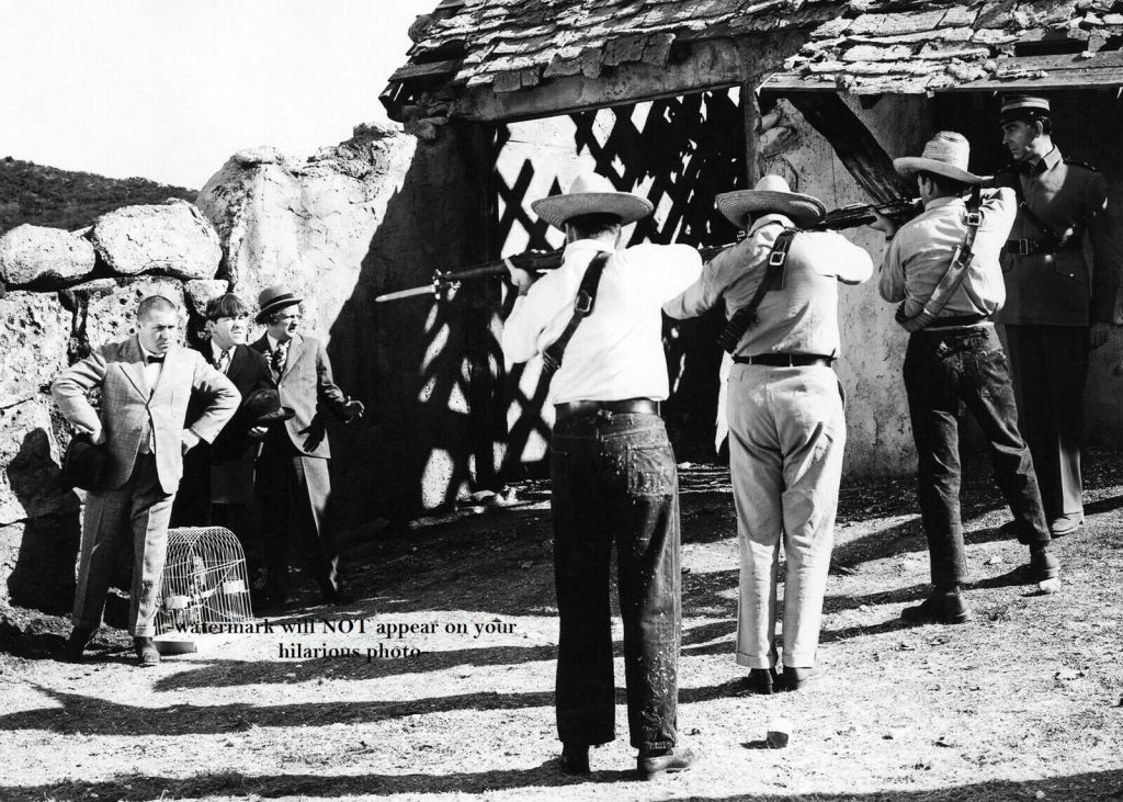 The Three Stooges (Curly, Larry, Moe) face a firing squad in Saved by the Belle