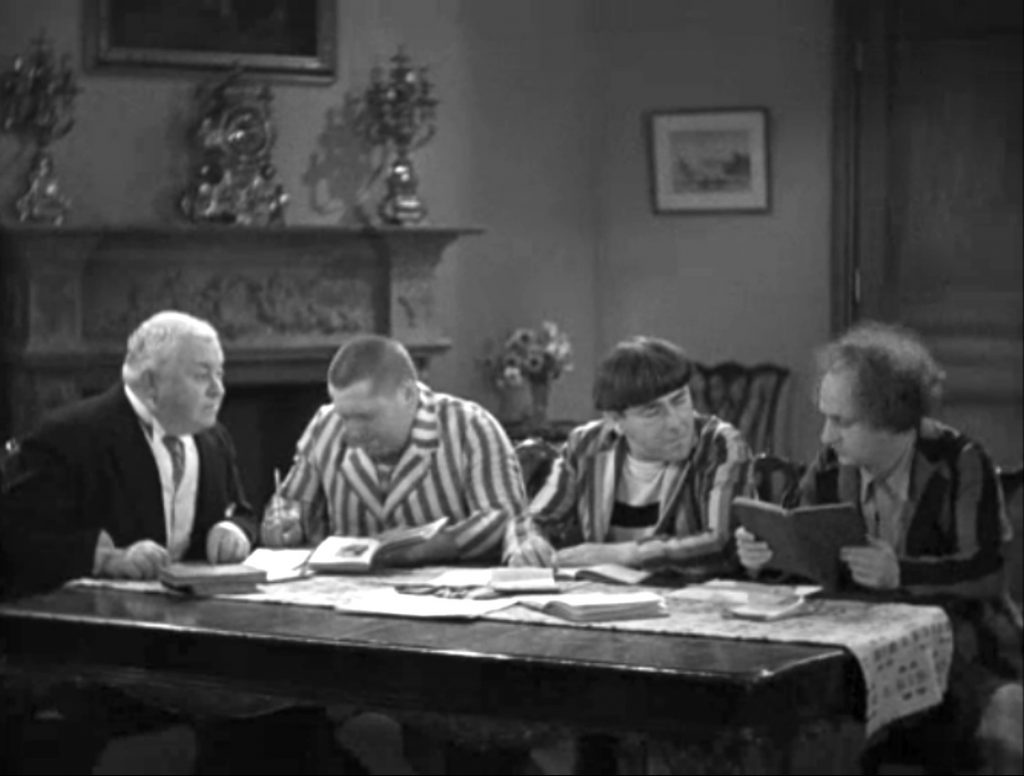 The Professor tries to teach the Three Stooges - Curly, Moe, Larrry - to read