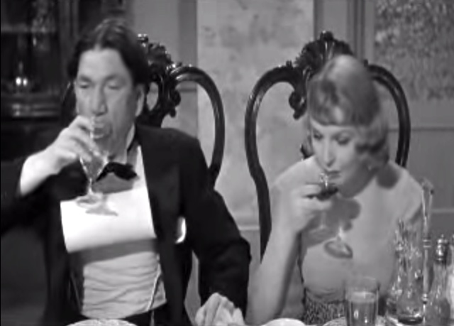 Income Tax Sappy - Shemp's tuxedo collar has a life of its' own, while Nanette Bordeaux looks on