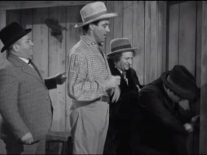 The Three Stooges go into the room, to cheat the hotel manager out of their rent!
