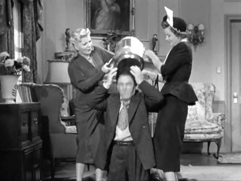 Shemp's escaped, and Belle and Millie rescue Moe in "He Cooked His Goose"