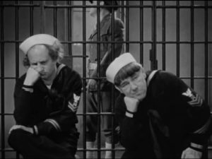 Three Little Sew and Sews - Moe and Larry thrown into the brig for assaulting an officer, courtesy of Curly!