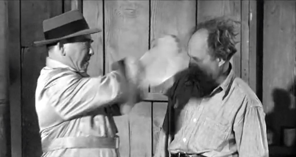 Moe punches Larry through his straw hat -- which he then uses for kindling