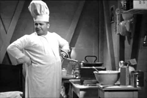 Curly as the "chef" in the moving boxcar in Movie Maniacs