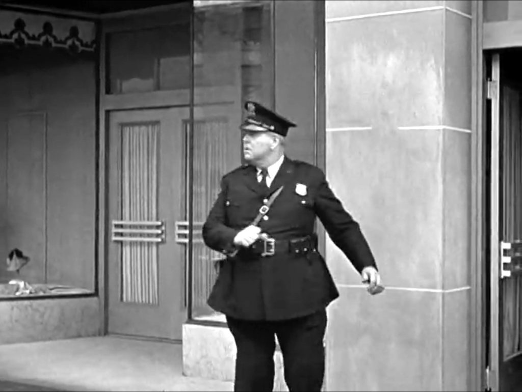 Officer Bud Jamison about to have the Three Stooges drop in on him - literally!