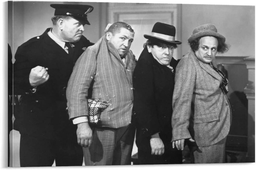 Officer Bud Jamison arresting the Three Stooges (Curly Howard, Moe Howard, Larry Fine)