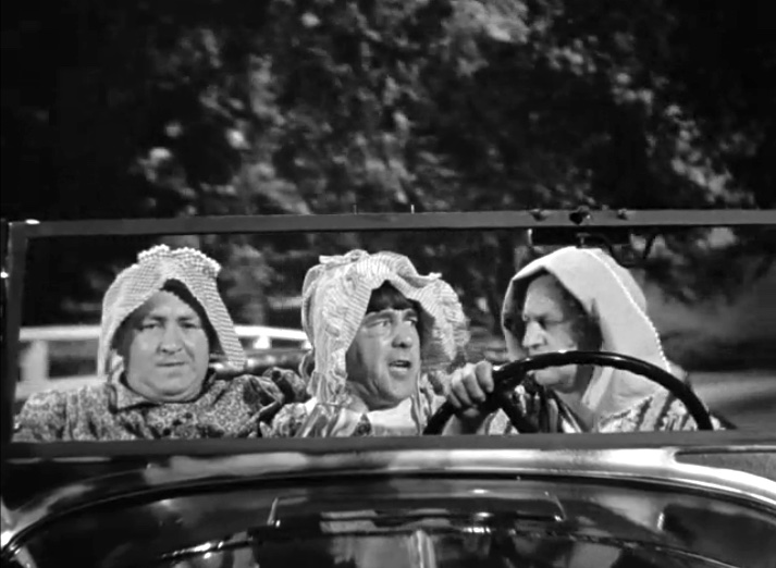 Oily to Bed, Oily to Rise - the Three Stooges (Curly, Moe, Larry) dressed in dresses, pursuing the deed