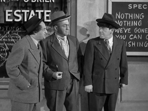 The Three Stooges (Larry, Curly, Moe) outside the real estate office with no vacancies in "G.I. Wanna Home"