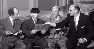 Pies and Guys - reading lesson for the Three Stooges, once Moe turns his book right-side up