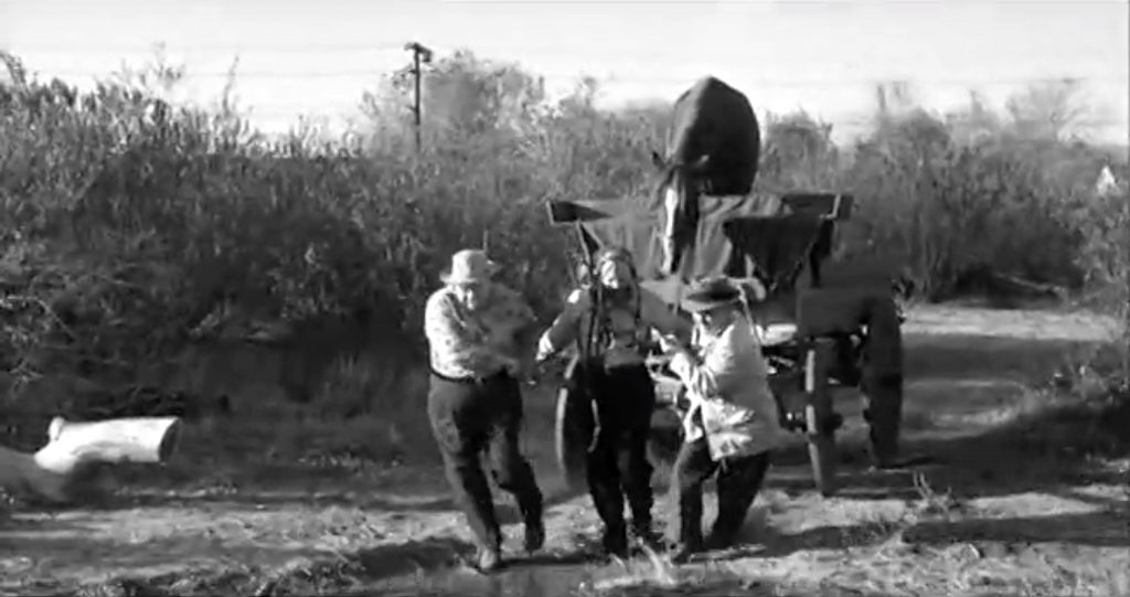 The Three Stooges (Moe, Larry, Joe Besser) pulling Birdie in the cart. Look out for that waterhole!