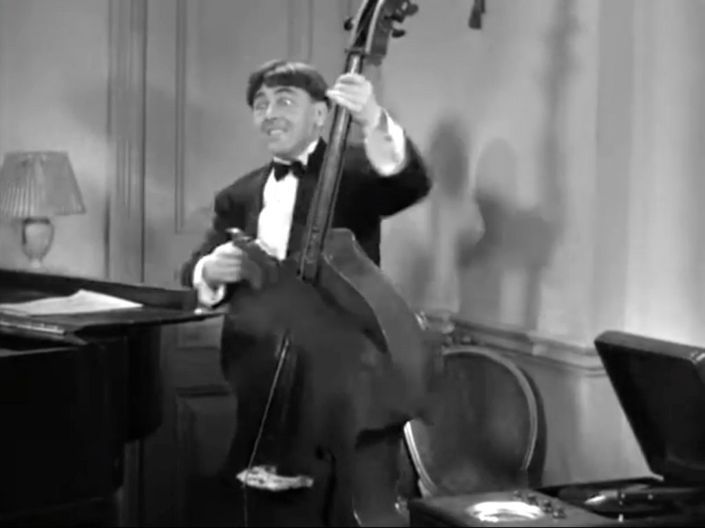 Moe Howard sawing through the cello in "Termites of 1938"