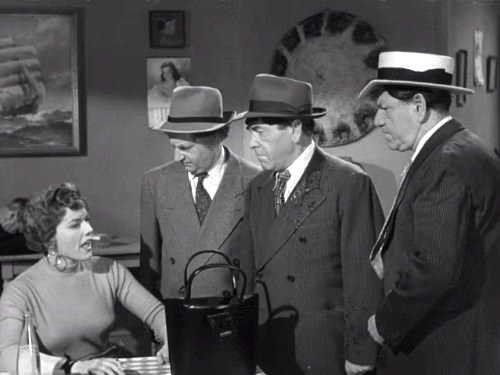 Barbara Bartay being interrogated by the Three Stooges (Larry Fine, Moe Howard, Shemp Howard) in "Hot Ice"