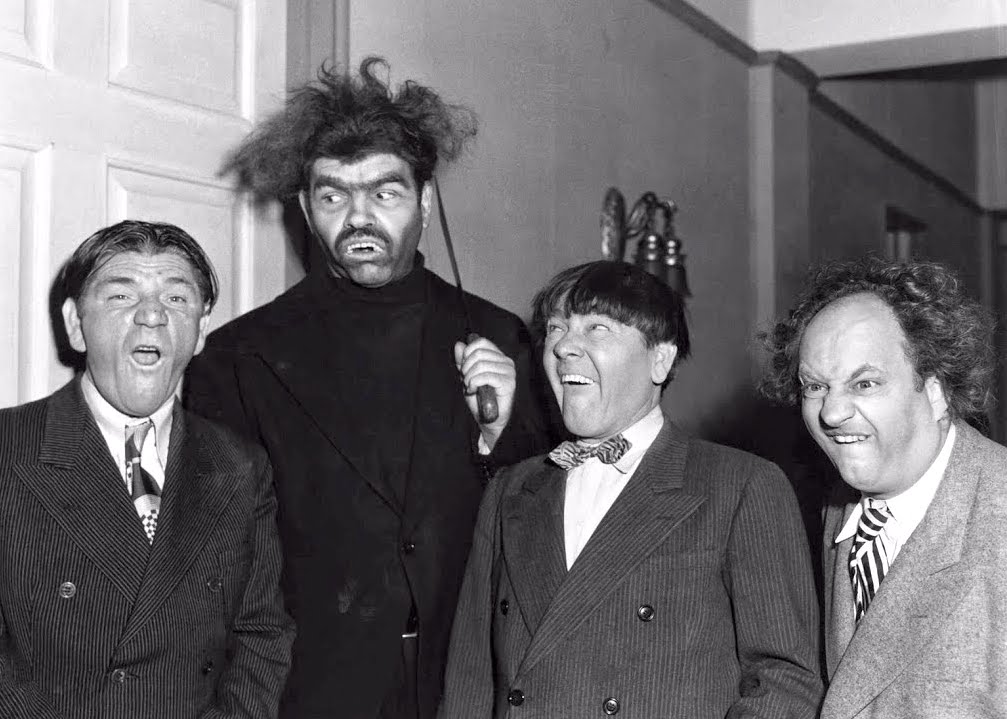 Shemp Howard, Angel (Duke York), Moe Howard, Larry Fine in a publicity photo for "Shivering Sherlocks"