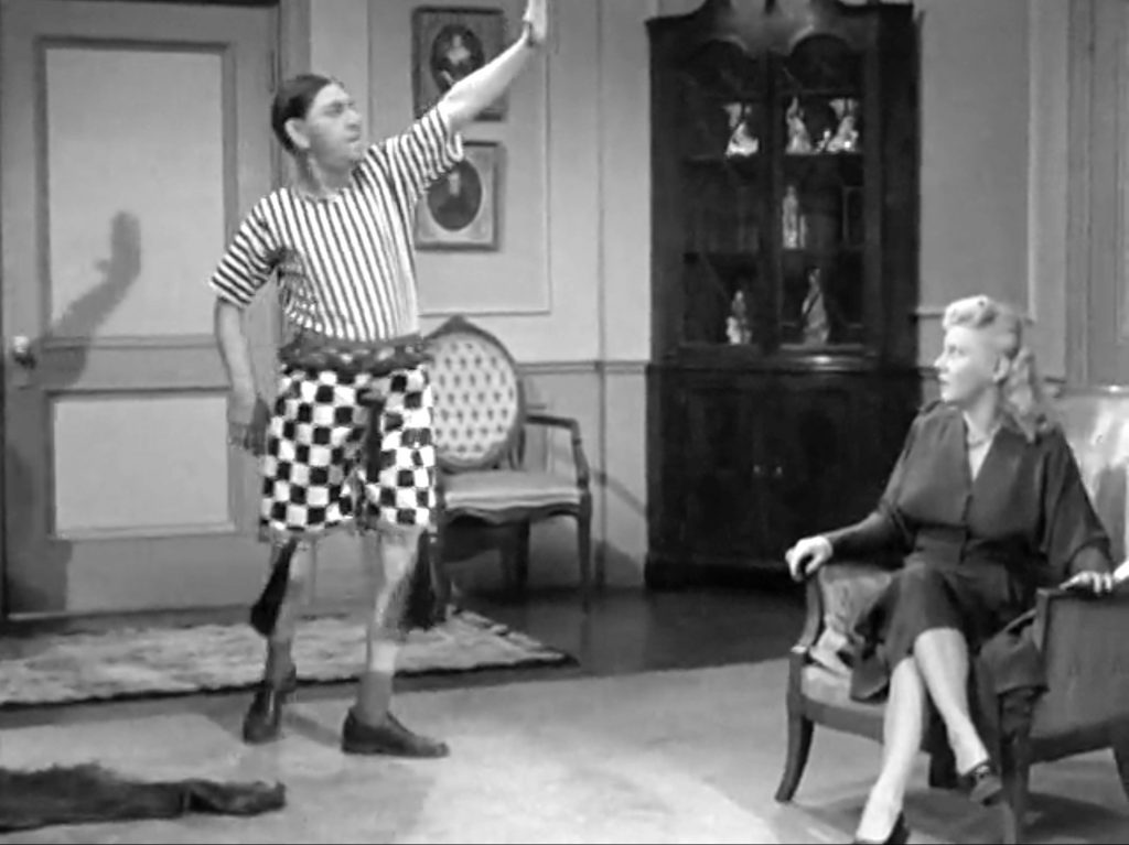 Shemp innocently models mens' pajamas for Belle in "He Cooked His Goose"