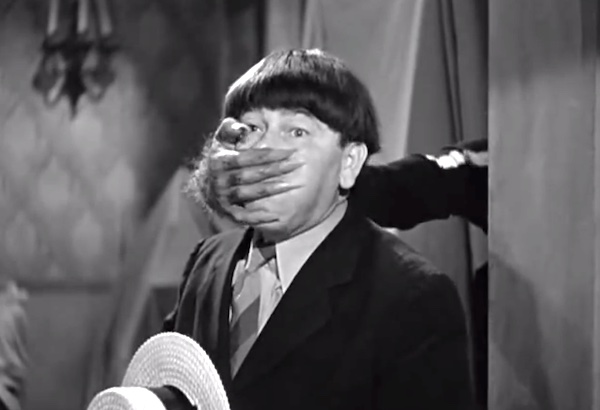 Spook Louder - one of the spies gives Moe Howard a hand