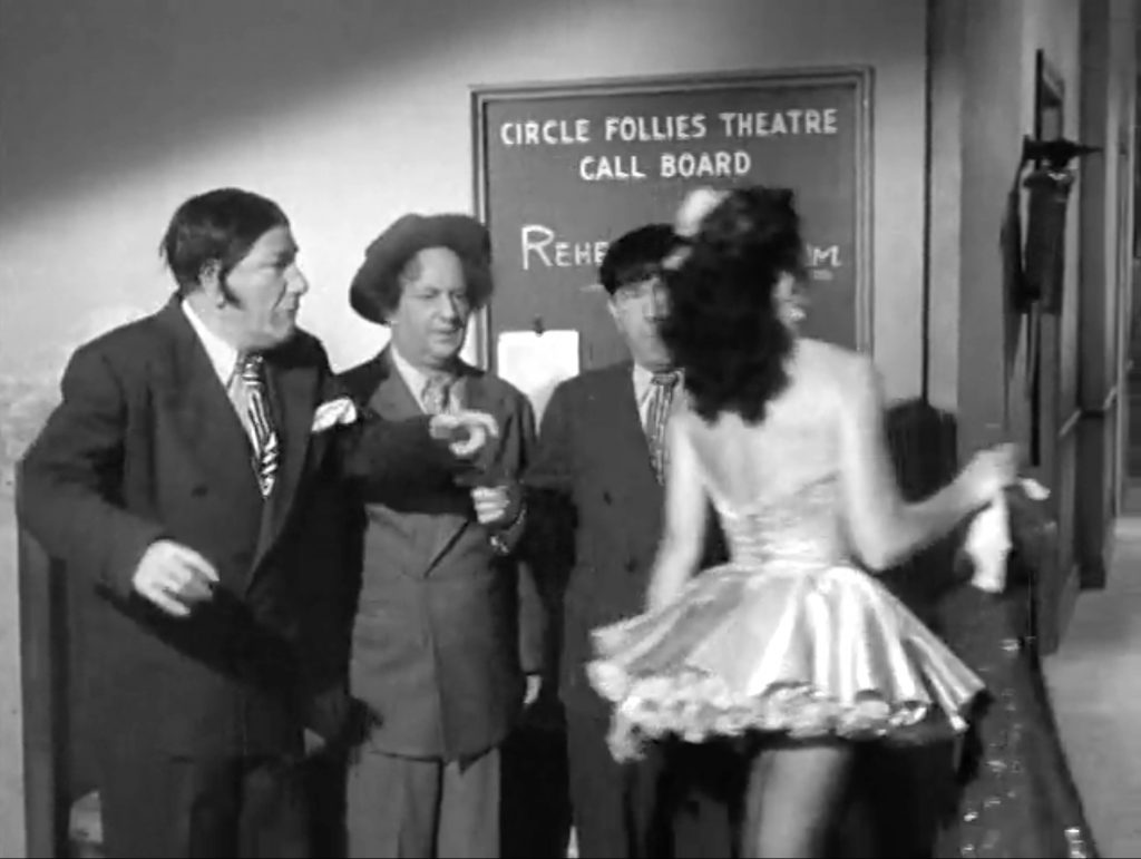 The Three Stooges are distracted by pretty showgirls - who later try to steal their money in "Loose Loot"