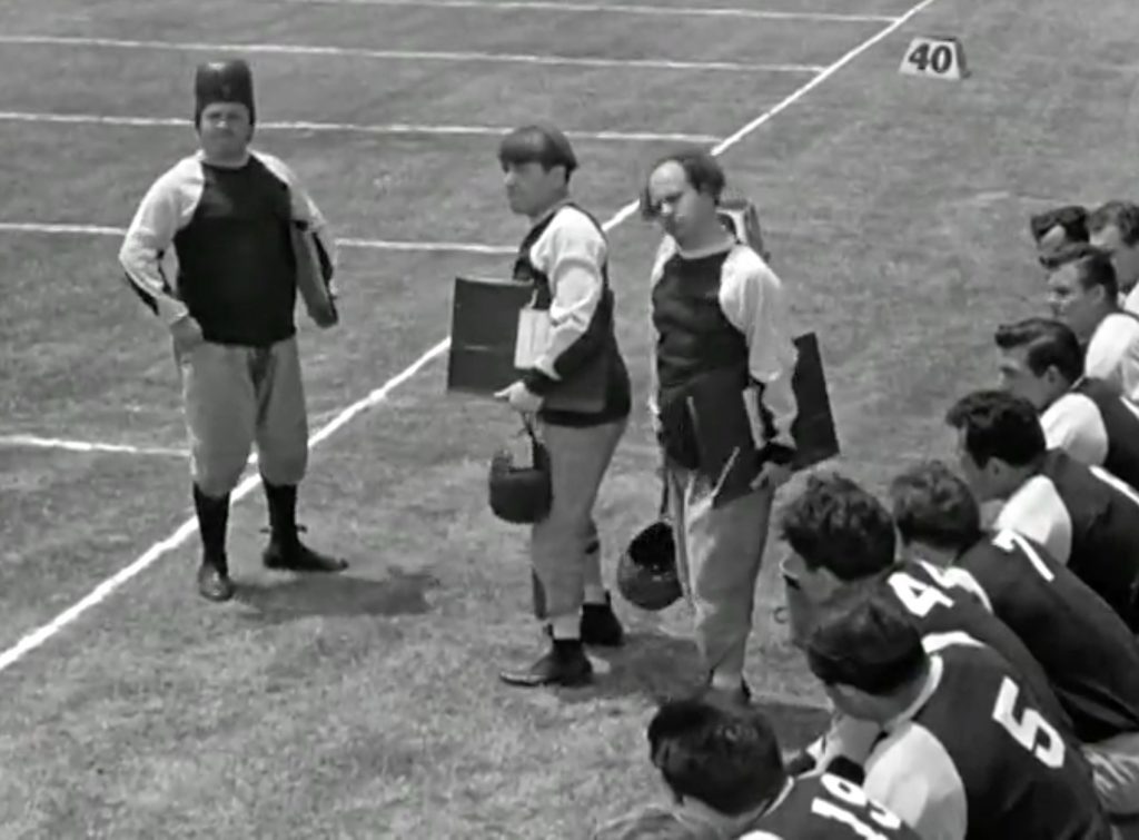 Three Stooges on the football sidelines in "No Census, No Feeling"