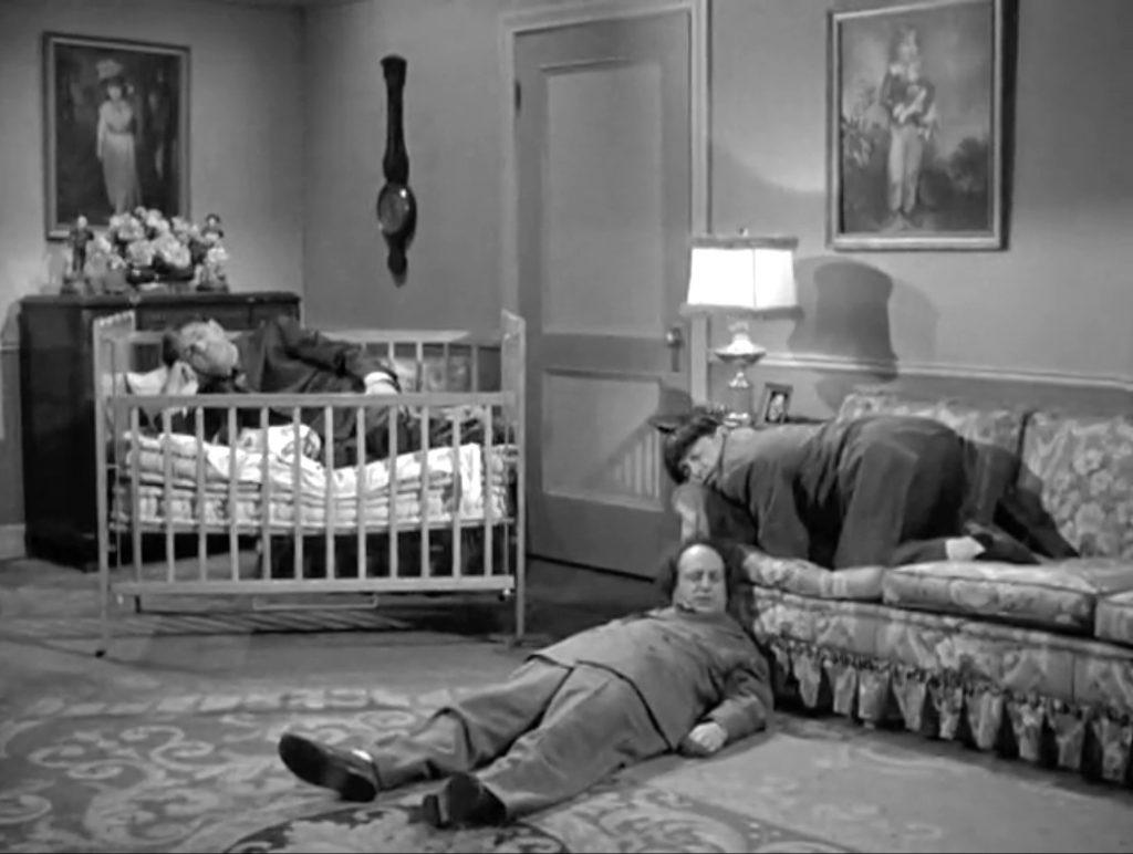 The Three Stooges are literally asleep on the job - but it's 3 in the morning, so we can't blame them.  Shemp was literally sleeping in the crib with the baby.  Who's missing!