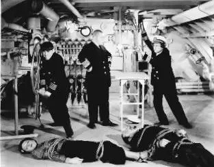 Three Little Sew and Sews - publicity photo - the Three Stooges (Moe, Larry, Curly) stand triumphant over the spies on the submarine