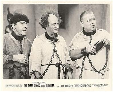 The Three Stooges (Moe, Larry, Curly Joe) in chains in Three Stooges Meet Hercules