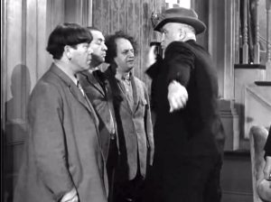 When a Body Meets a Body - the detective gives the Three Stooges a triple slap